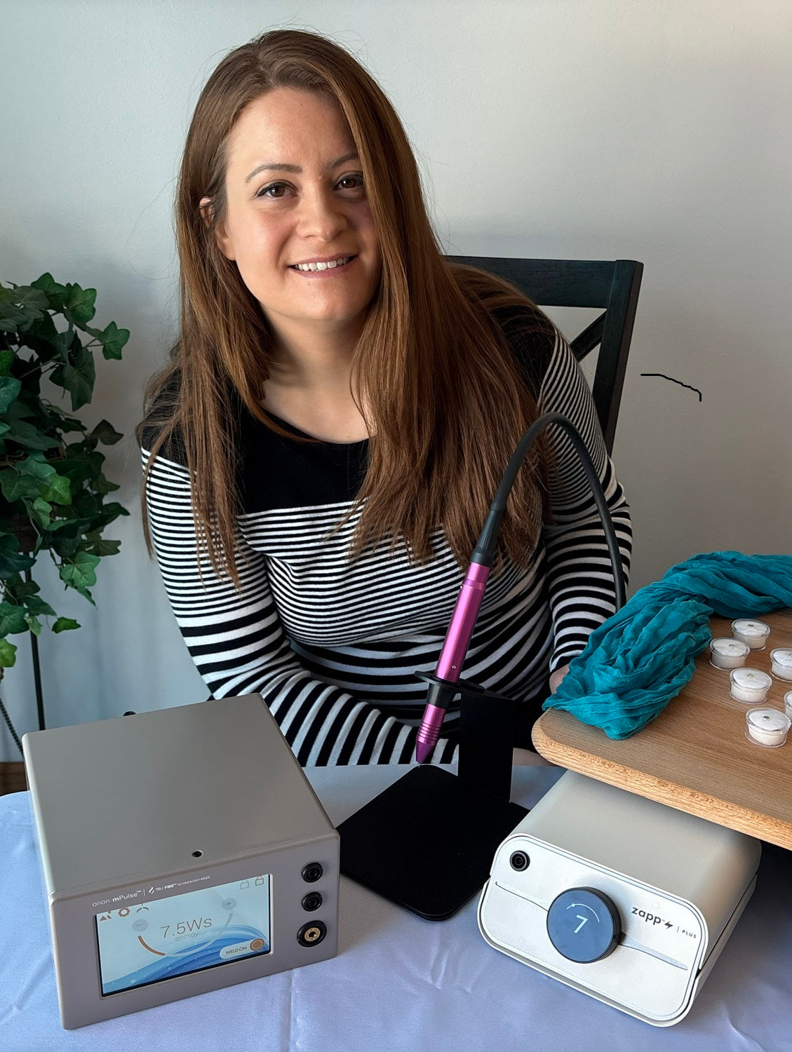 Trinity smiling with Sunstone permanent jewelry welding machines